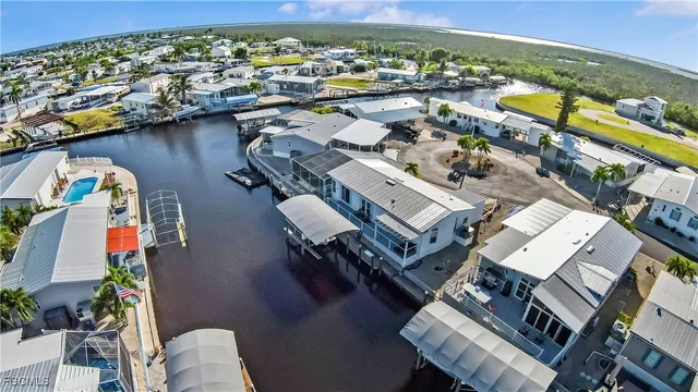 a living room with furniture a flat screen tv and a window