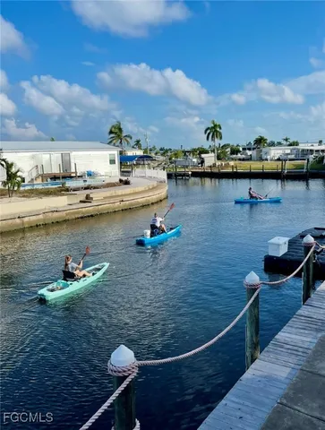 a bedroom with a bed chair and window