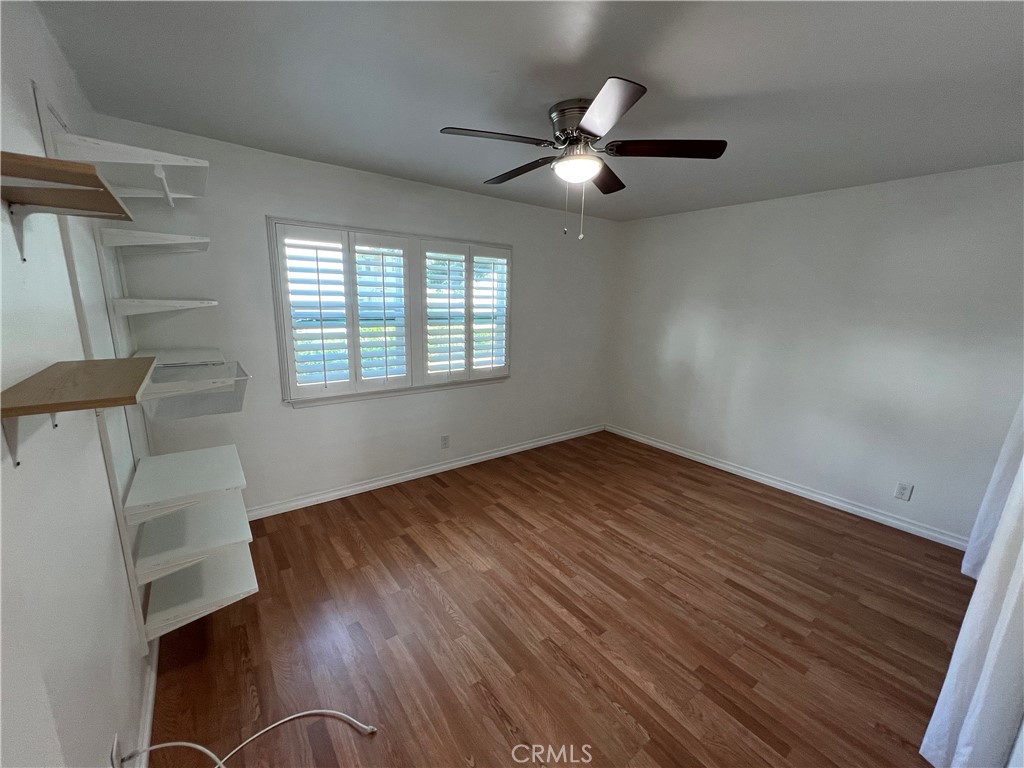5835 Bowcroft Street, Unit 2 Los Angeles, CA 90016 - Photo 11 of 30 a view of empty room with wooden floor and fan