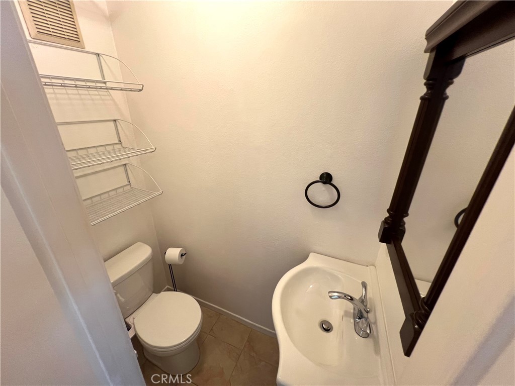 5835 Bowcroft Street, Unit 2 Los Angeles, CA 90016 - Photo 14 of 30 a bathroom with a toilet and a sink