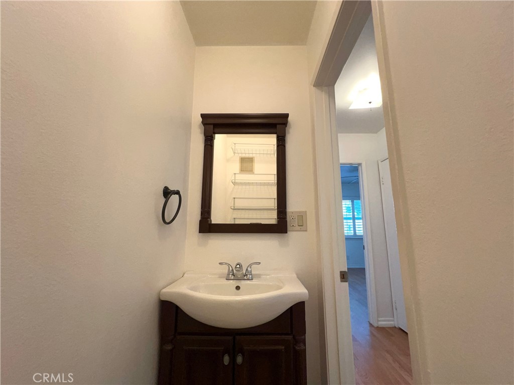 5835 Bowcroft Street, Unit 2 Los Angeles, CA 90016 - Photo 15 of 30 a bathroom with a sink and a mirror