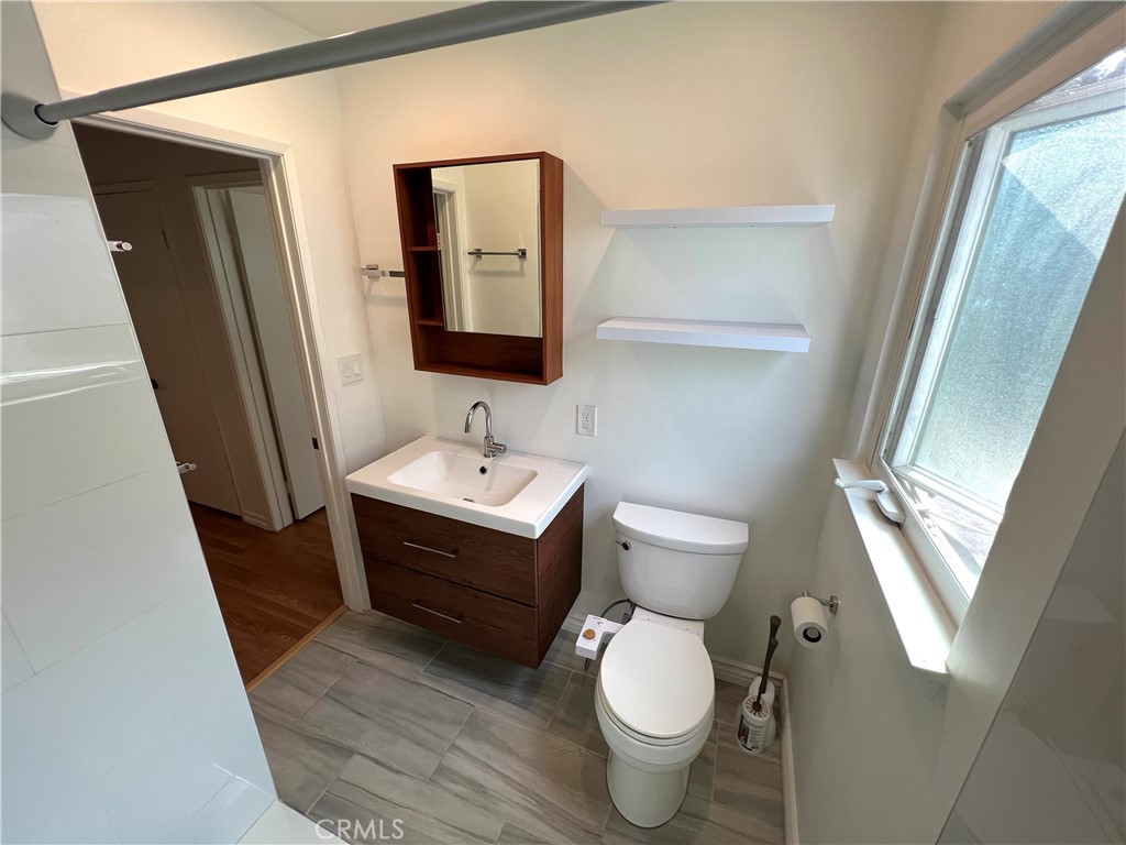 5835 Bowcroft Street, Unit 2 Los Angeles, CA 90016 - Photo 18 of 30 a bathroom with a sink toilet and mirror