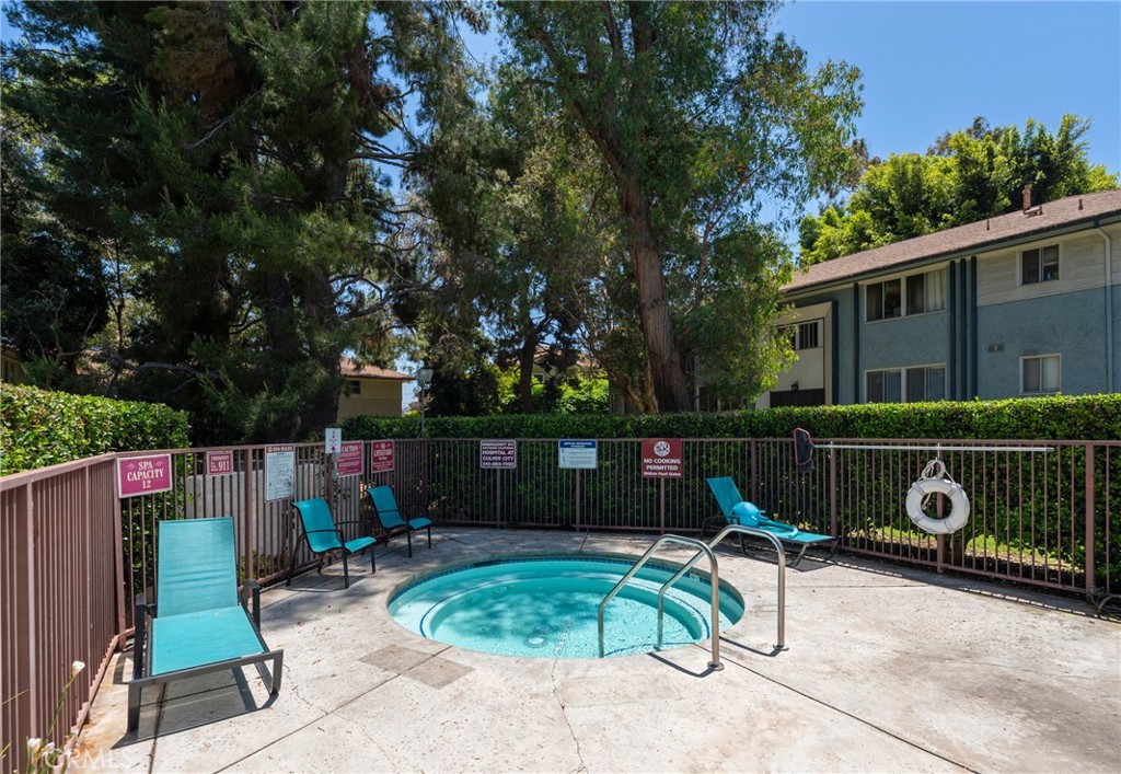 5835 Bowcroft Street, Unit 2 Los Angeles, CA 90016 - Photo 27 of 30 a backyard of a house with barbeque oven table and chairs