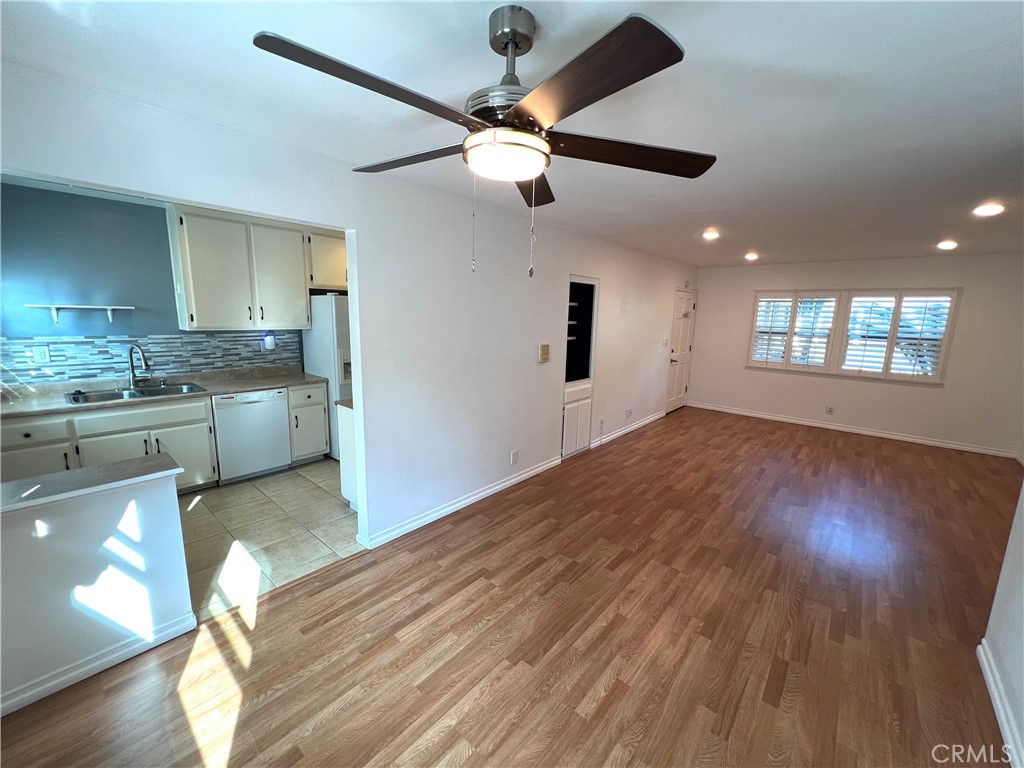 5835 Bowcroft Street, Unit 2 Los Angeles, CA 90016 - Photo 5 of 30 a open kitchen with granite countertop a stove and a wooden floors
