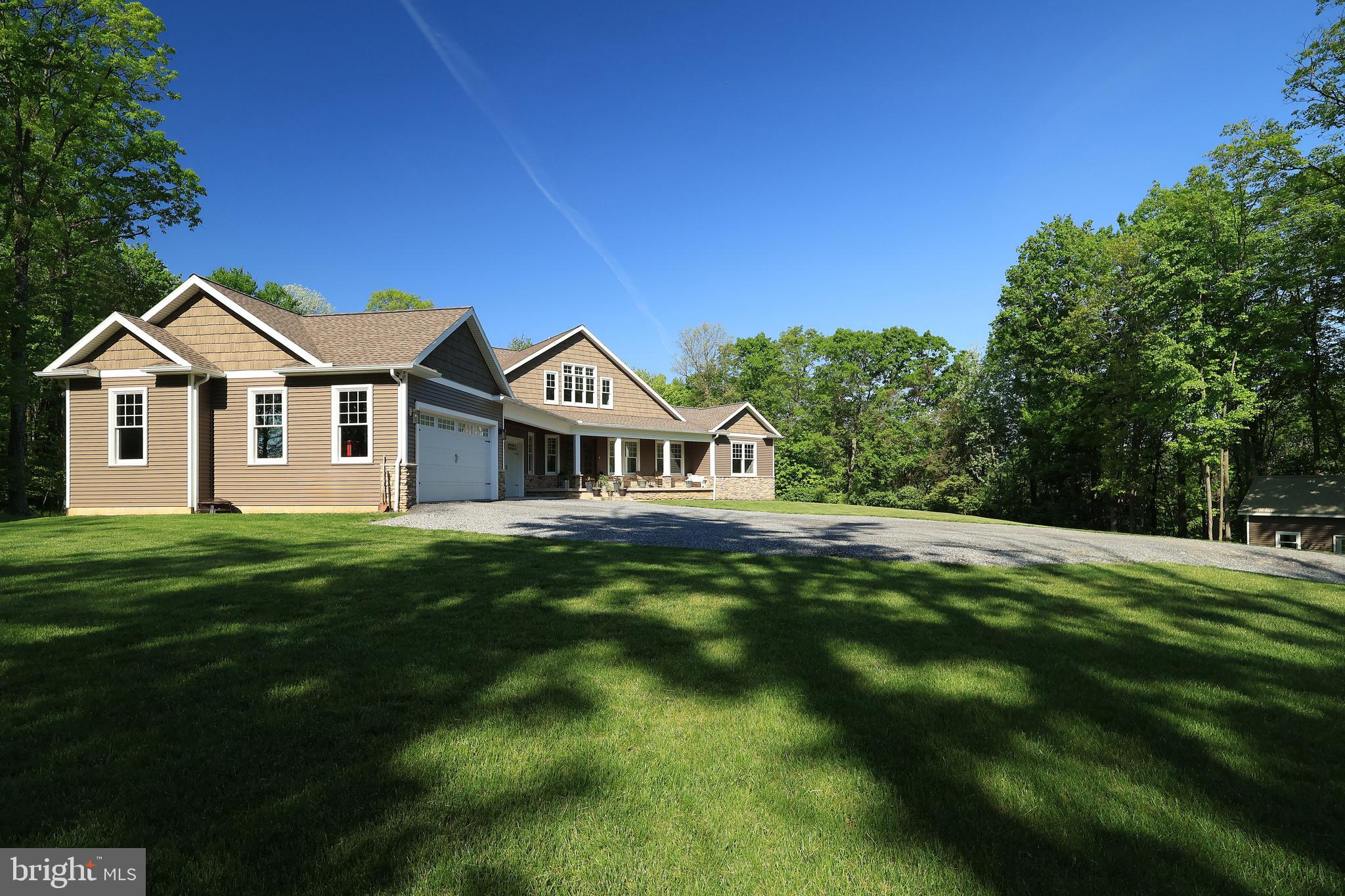 518 Two Mile Road Howard, PA 16841 - Photo 82 of 84 a front view of a house with a garden