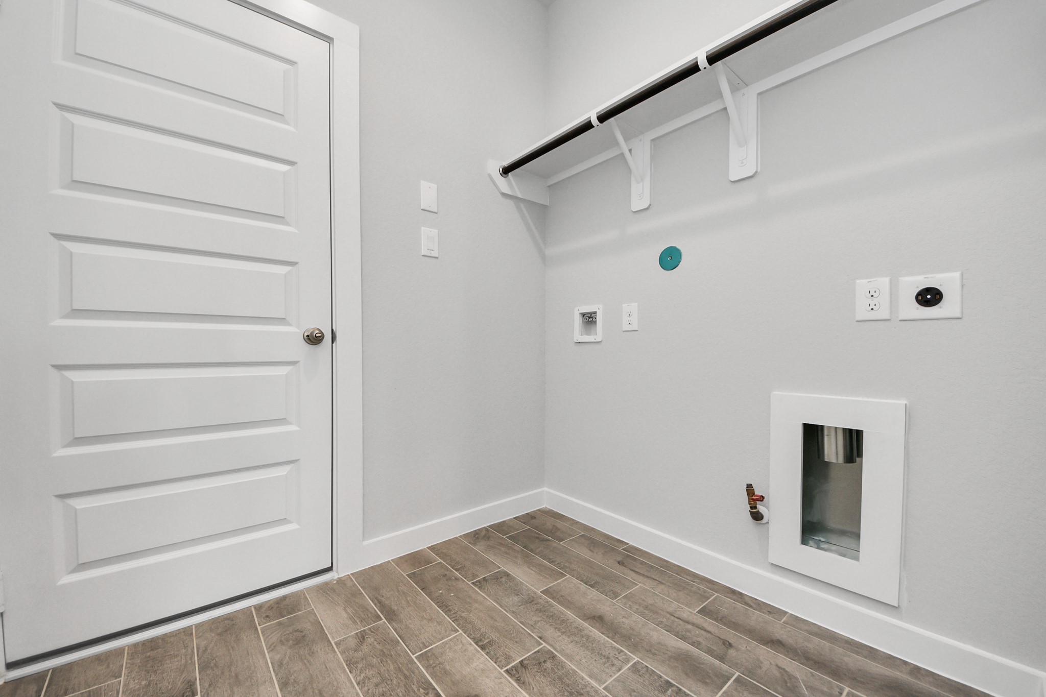 3002 Bury Park Dr Spring Spring, TX 77373 - Photo 41 of 45 A perfect blend of functionality and comfort. Capture the essence of easy living with a first-floor laundry room, thoughtfully equipped with shelving for effortless organization. Both electric and gas connections available.