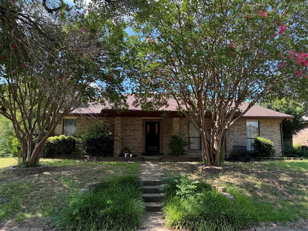 2902 Spring Brook Drive Garland, TX 75044 - Photo 1 of 1 front view of a house with a yard