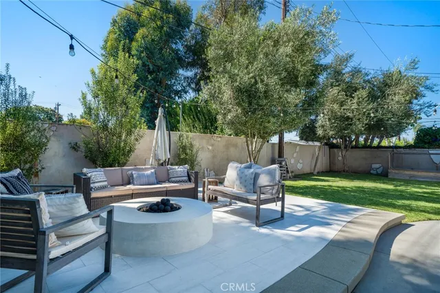 a view of a bench in the backyard