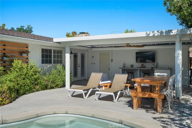 a view of a terrace with furniture and garden