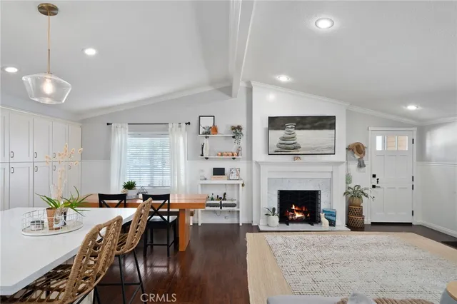 a view of a livingroom with furniture window and wooden floor
