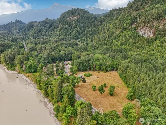 an aerial view of a house with a yard