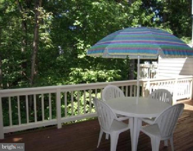 11509 Hemingway Drive Reston, VA 20194 - Photo 2 of 21 a view of balcony with table and chairs