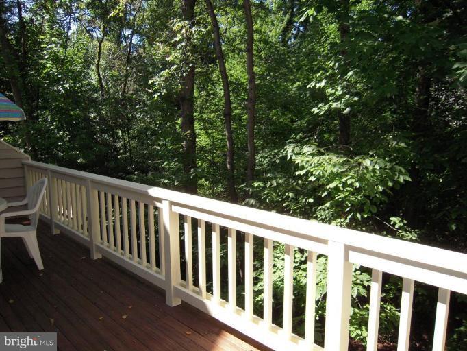 11509 Hemingway Drive Reston, VA 20194 - Photo 11 of 21 a balcony with wooden floor and fence