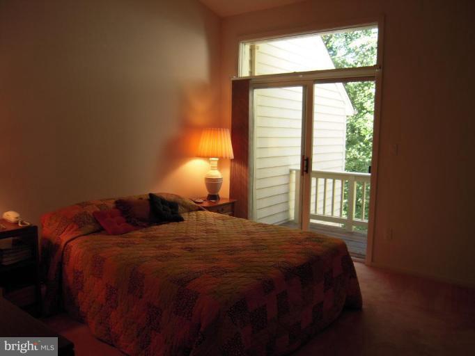 11509 Hemingway Drive Reston, VA 20194 - Photo 15 of 21 a bedroom with a bed and a window