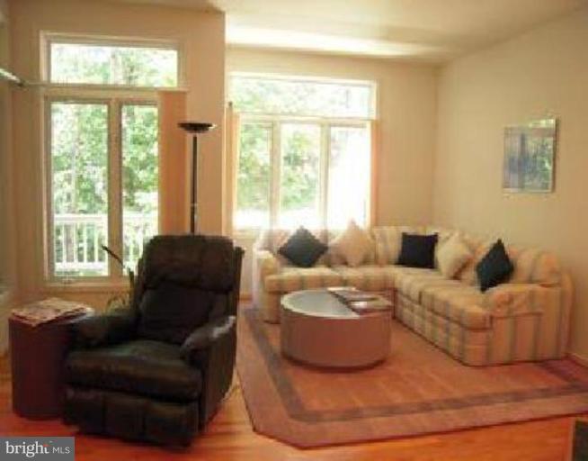 11509 Hemingway Drive Reston, VA 20194 - Photo 6 of 21 a living room with furniture and a large window