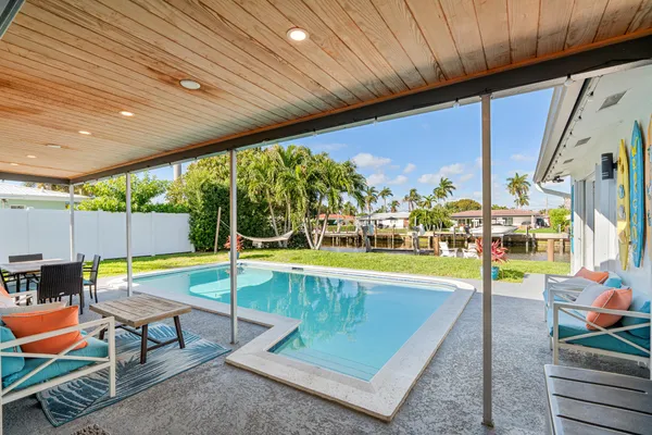 swimming pool with outdoor seating