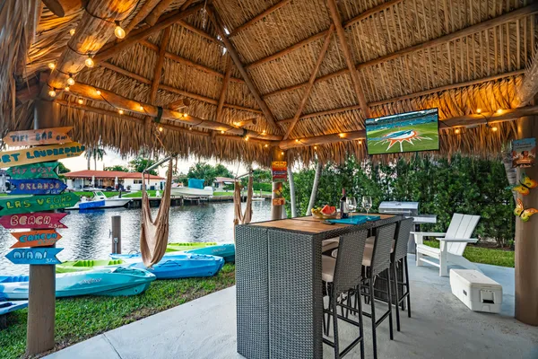 a view of swimming pool with outdoor seating