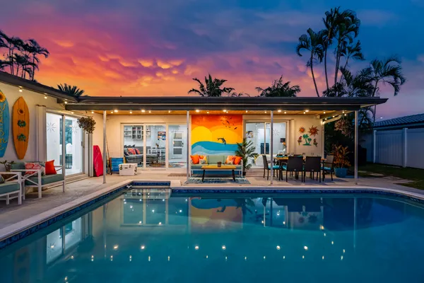 a view of swimming pool with lounge chair