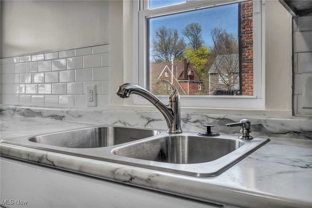 3239 Sycamore Road Cleveland, OH 44118 - Photo 27 of 49 Details with a sink and backsplash