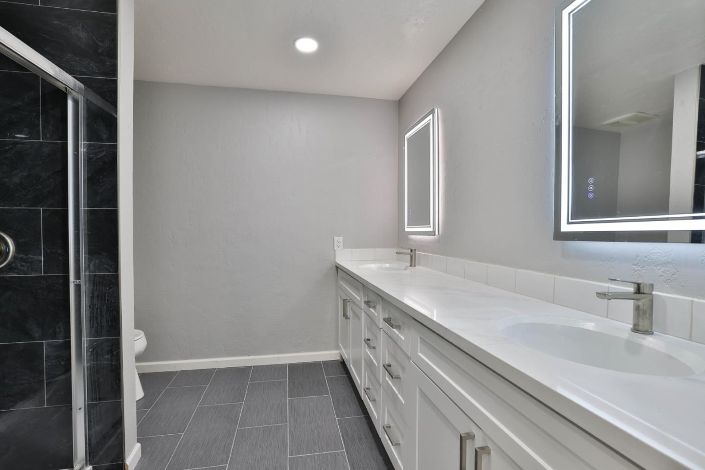 365 San Andreas Drive Milpitas, CA 95035 - Photo 13 of 26 a bathroom with a sink and a mirror