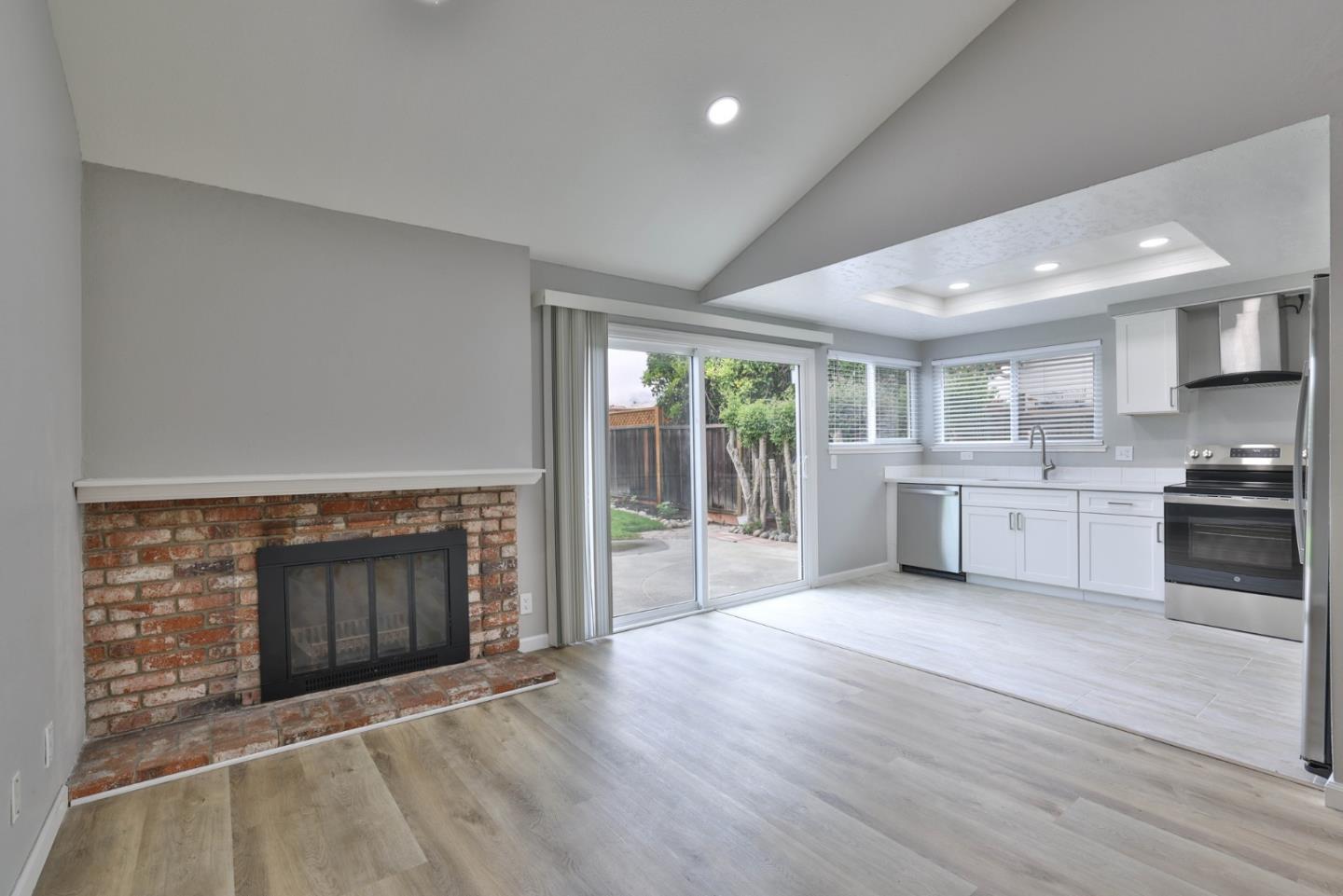365 San Andreas Drive Milpitas, CA 95035 - Photo 21 of 26 a view of a kitchen with a sink stove cabinets and empty room