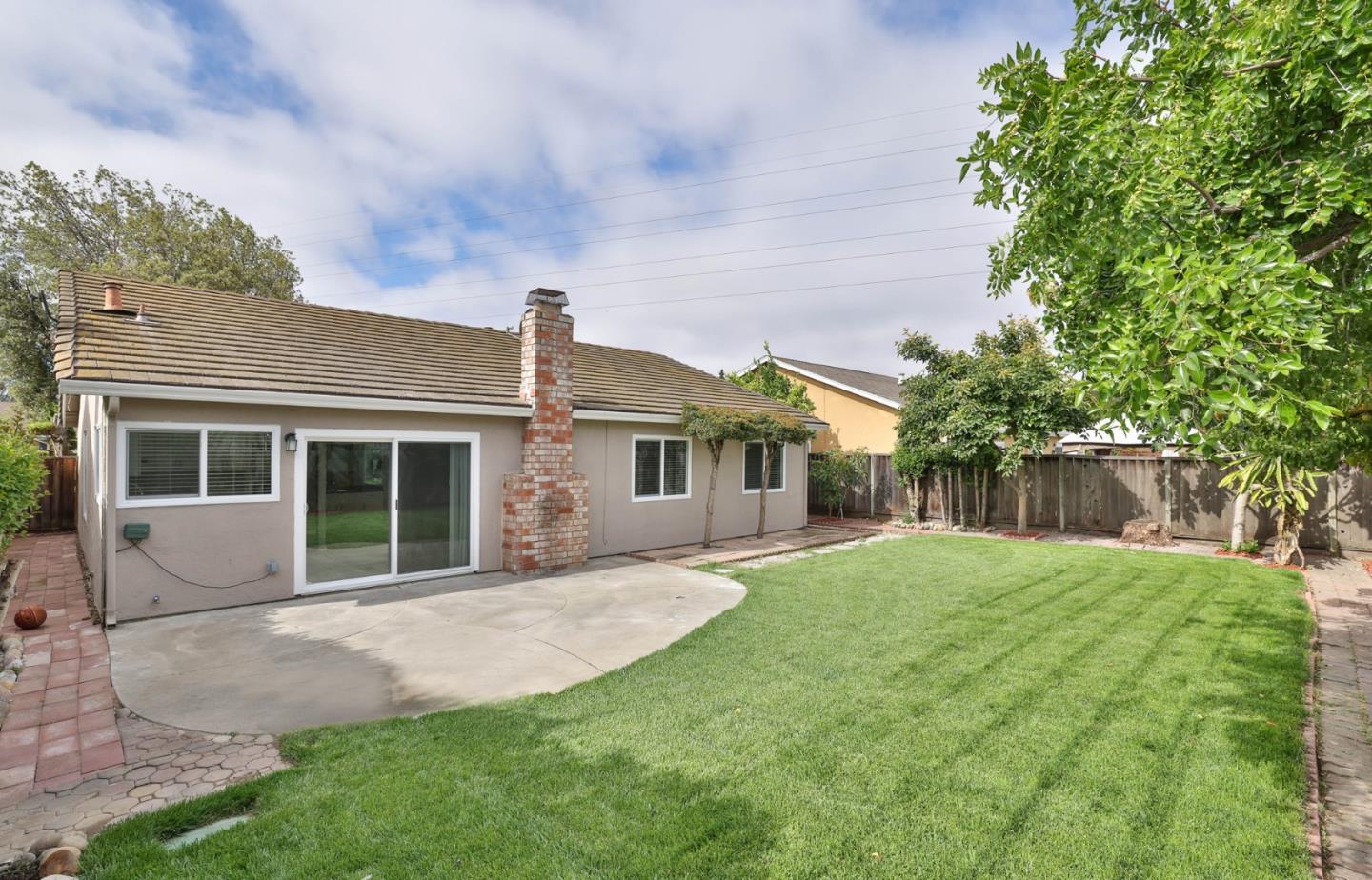 365 San Andreas Drive Milpitas, CA 95035 - Photo 23 of 26 a front view of a house with a yard and potted plants