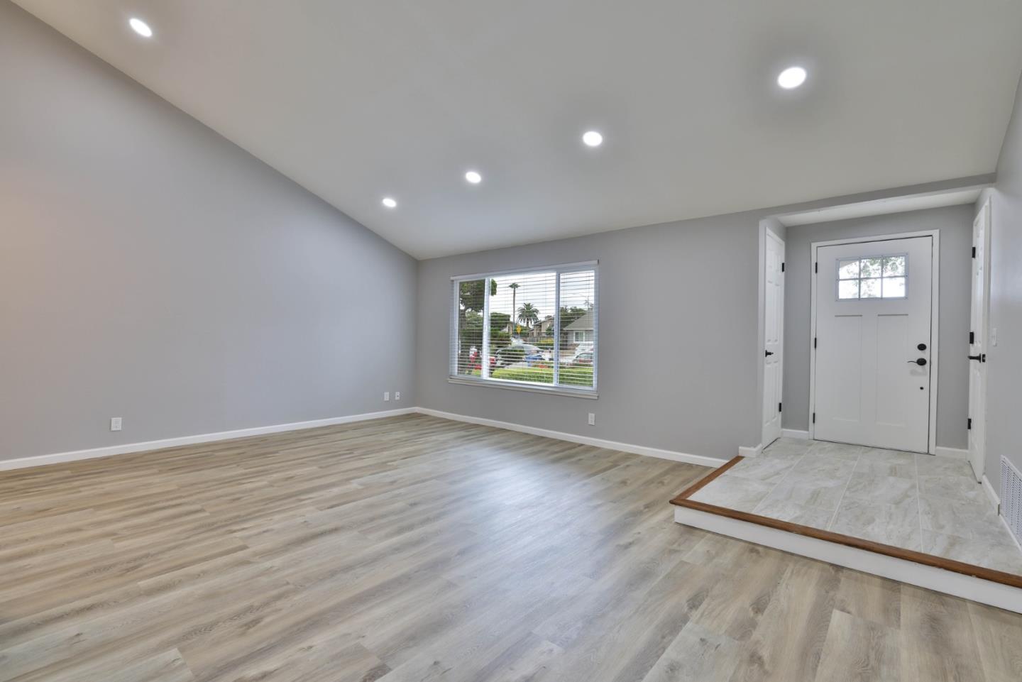 365 San Andreas Drive Milpitas, CA 95035 - Photo 4 of 26 an empty room with wooden floor and windows