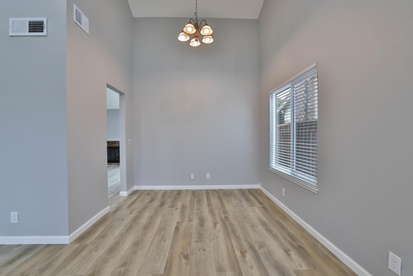 365 San Andreas Drive Milpitas, CA 95035 - Photo 5 of 26 a view of empty room with wooden floor and fan