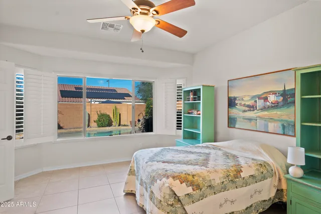 a spacious bathroom with a granite countertop double vanity sink mirror and shower