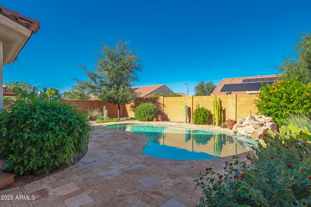 a view of a house with patio and a yard