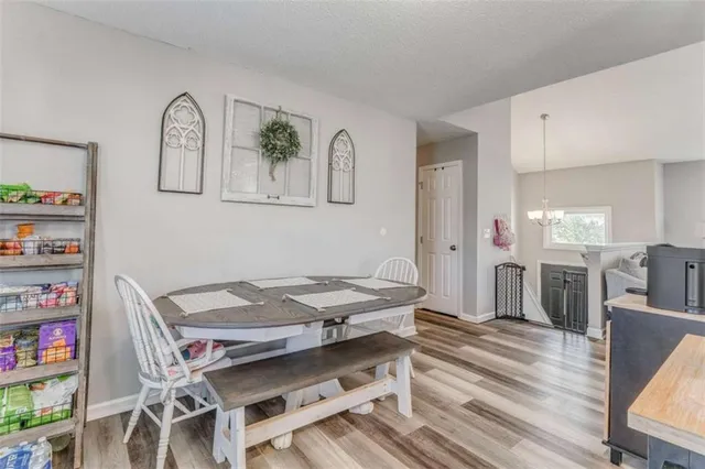 a reading room with furniture a rug and a window