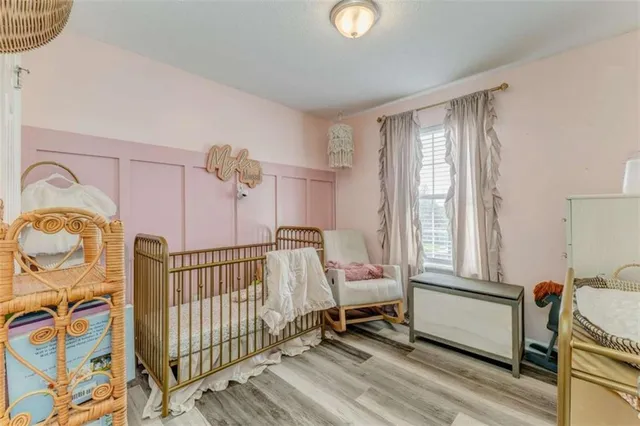 a bedroom with furniture and a window