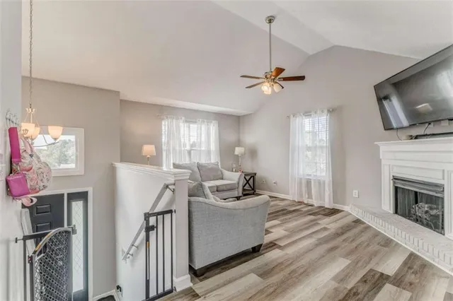 a living room with furniture fireplace and flat screen tv