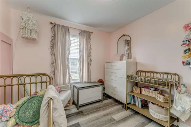 a bedroom with furniture and a window