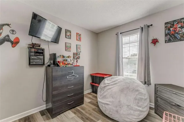 a room with toys and dresser