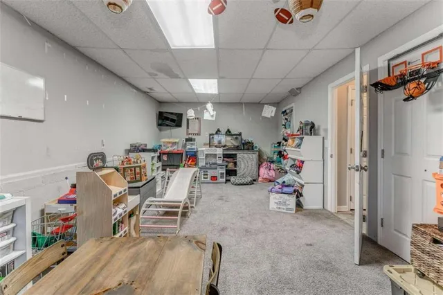a bathroom with a granite countertop sink a toilet and a mirror