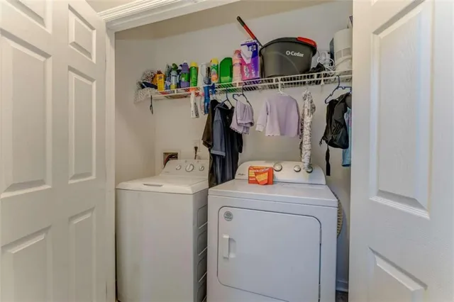 a view of a patio with table and chairs with wooden floor and fence