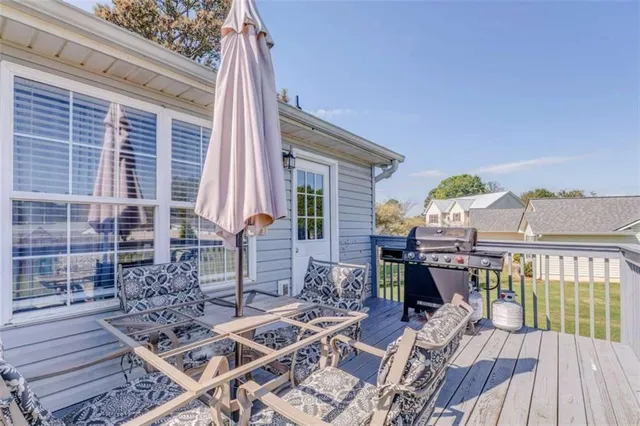 a view of a chairs and table on the deck