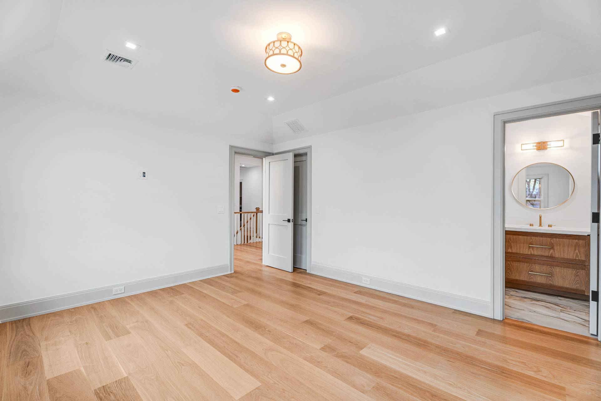93 South Country Road Remsenburg, NY 11960 - Photo 13 of 27 an empty room with closet and mirror