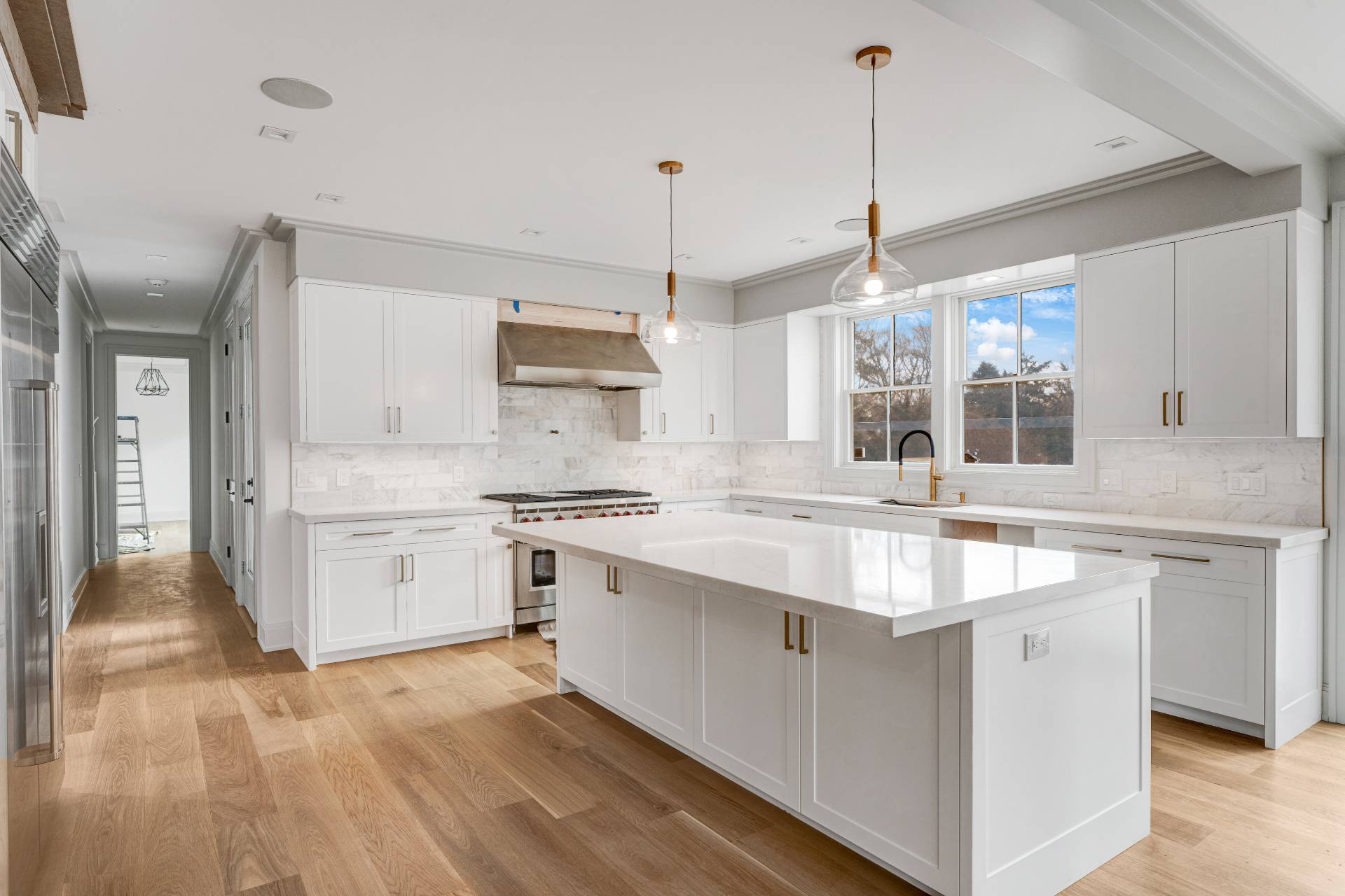 93 South Country Road Remsenburg, NY 11960 - Photo 17 of 27 a kitchen with stainless steel appliances granite countertop a sink stove and refrigerator
