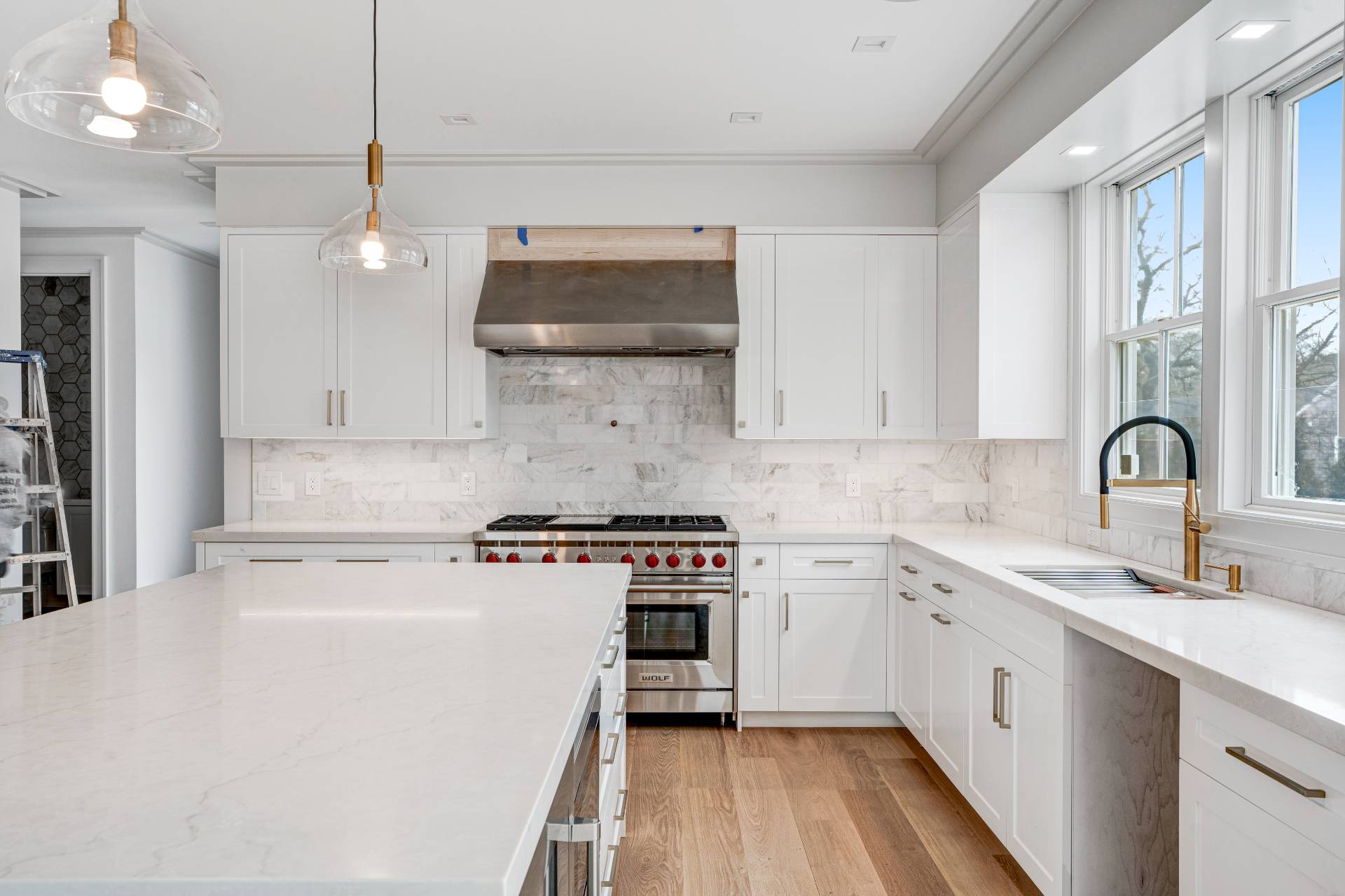 93 South Country Road Remsenburg, NY 11960 - Photo 19 of 27 a kitchen with stainless steel appliances a sink stove and cabinets