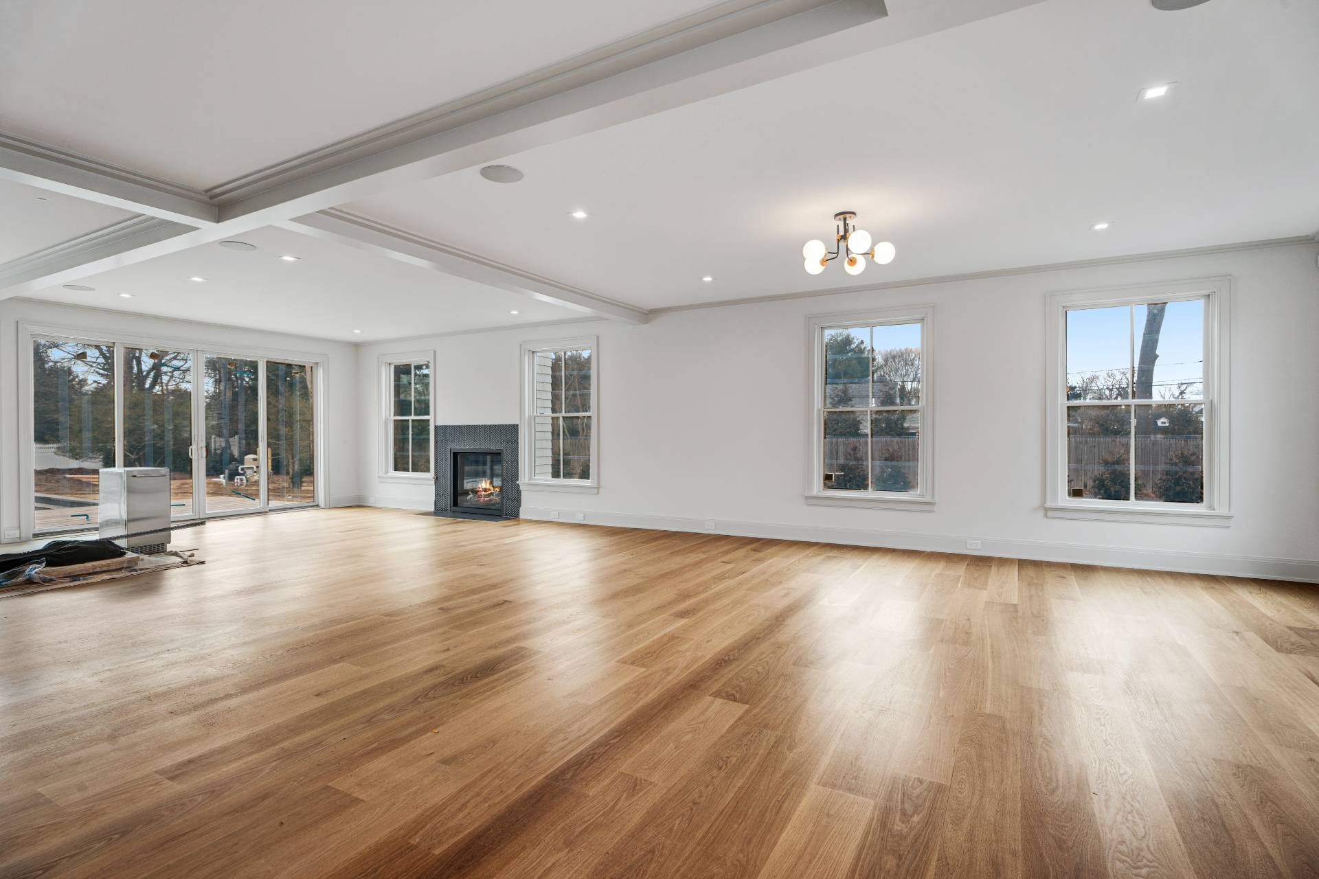 93 South Country Road Remsenburg, NY 11960 - Photo 2 of 27 a view of an empty room with wooden floor and a window
