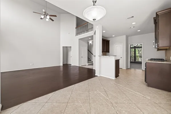 a view of a kitchen with furniture and wooden floor