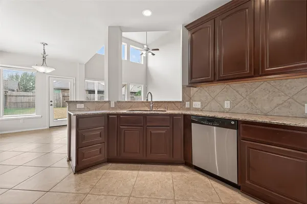 a kitchen with a sink and cabinets