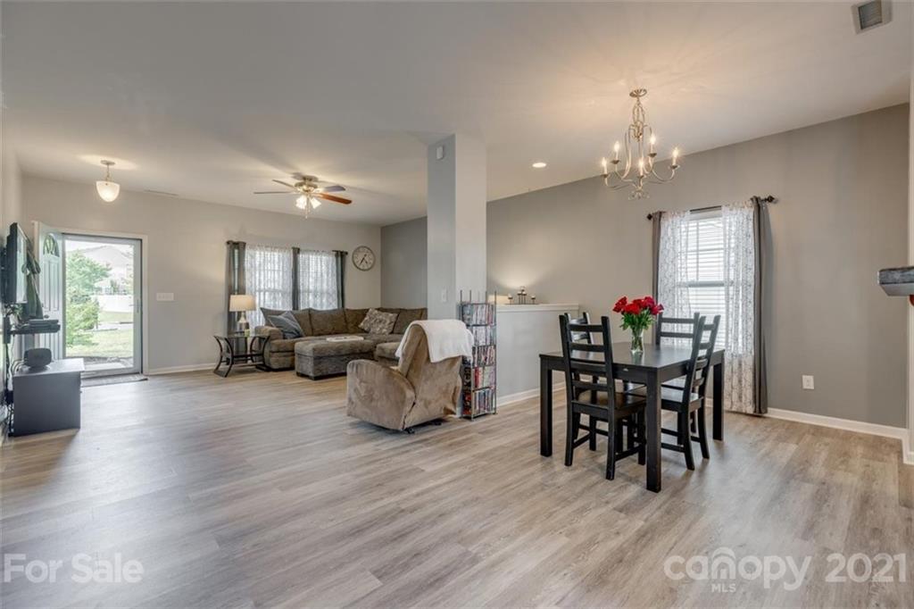 2174 Durand Road Fort Mill, SC 29715 - Photo 8 of 40 a living room with furniture and a chandelier