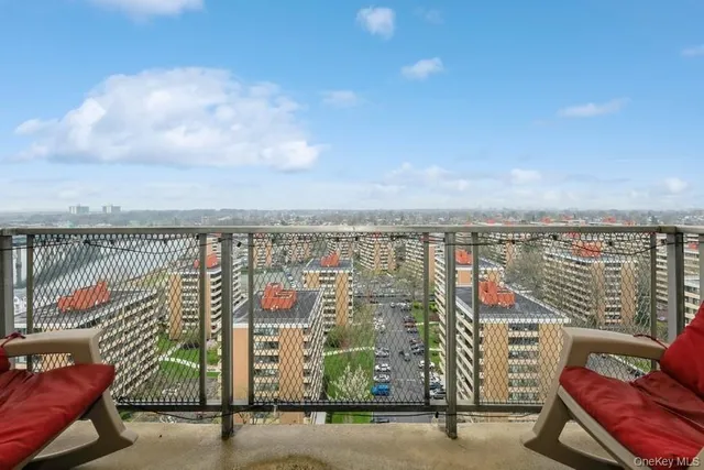 a city view with tall buildings and ocean view