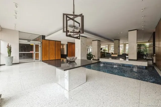 a view of a living room and kitchen