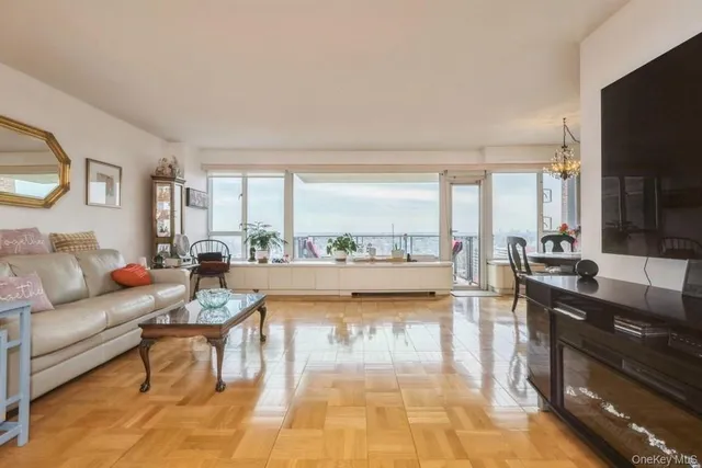 a living room with furniture and a large window