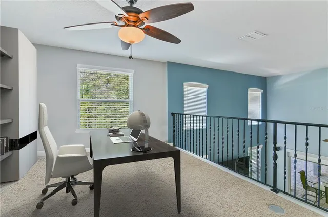 a workspace with furniture and a window