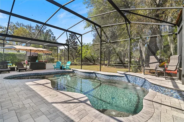 a view of a swimming pool with a patio